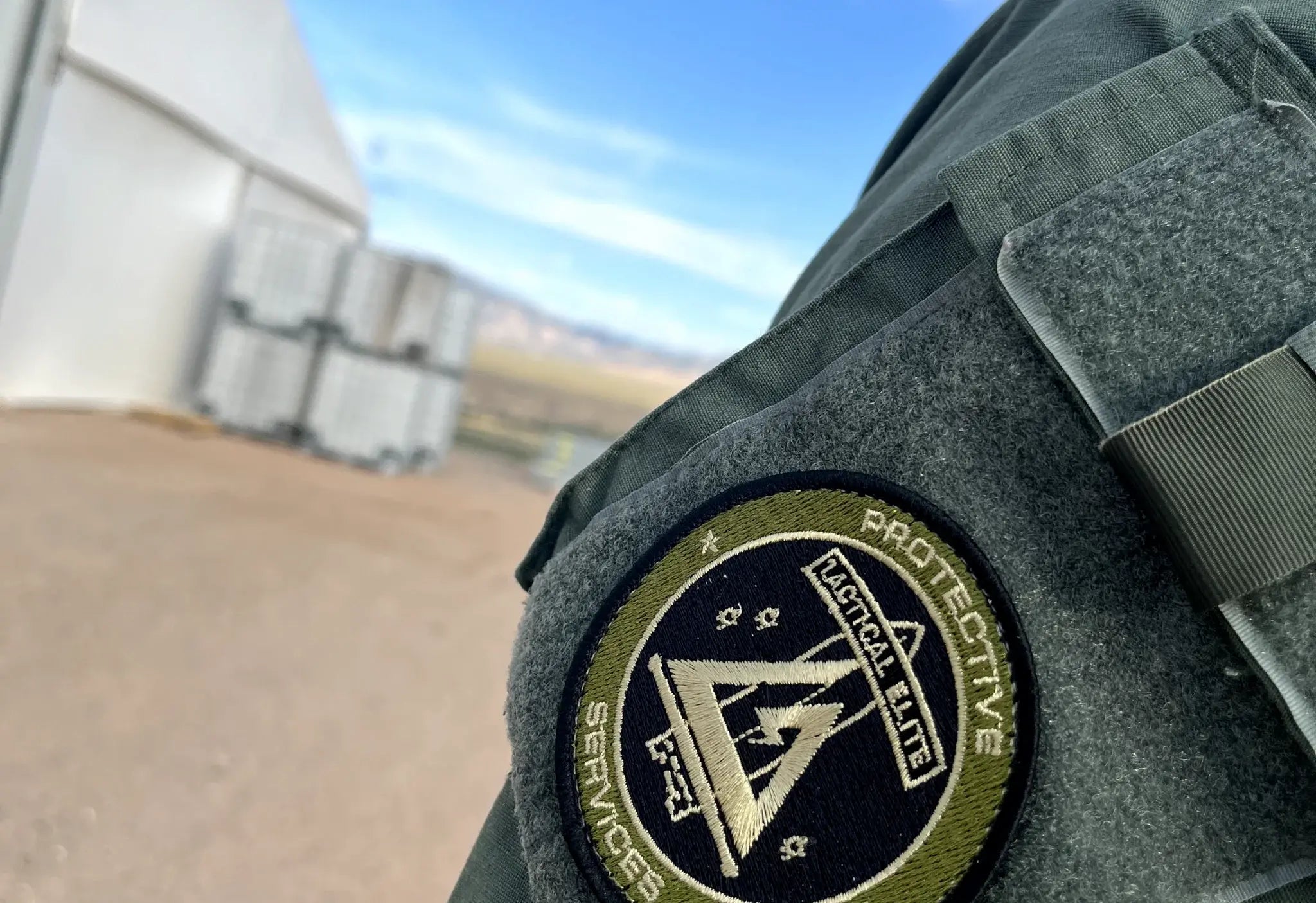 Marked Tactical Elite Protective Services patrol vehicle parked roadside, showcasing branded executive protection transport.